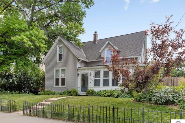 view of front of home with a front lawn