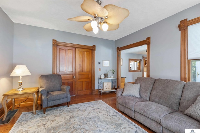 living room with hardwood / wood-style flooring and ceiling fan