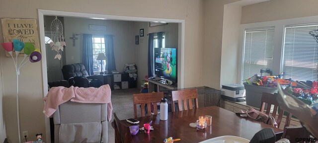 view of carpeted dining area