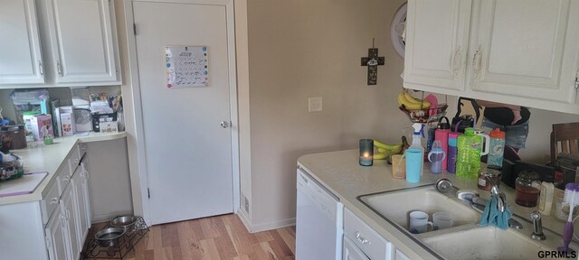 kitchen featuring sink, white cabinetry, light hardwood / wood-style flooring, and dishwasher