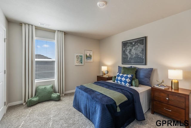 bedroom with light colored carpet