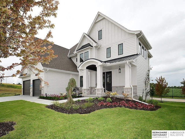 modern farmhouse with a front lawn and a porch