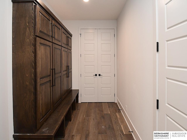 mudroom with dark hardwood / wood-style flooring