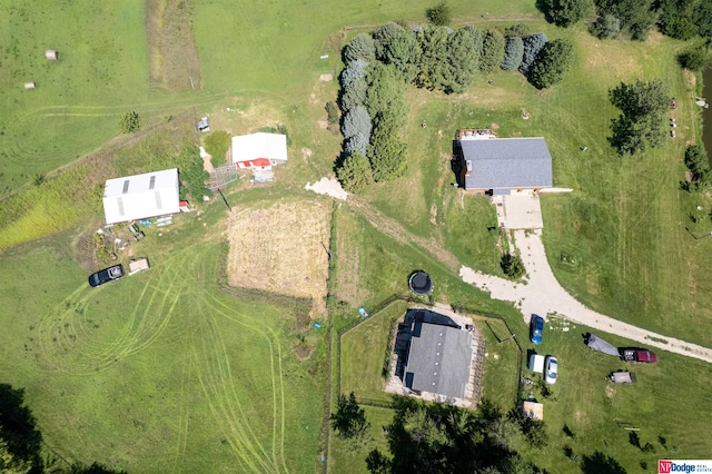 birds eye view of property with a rural view