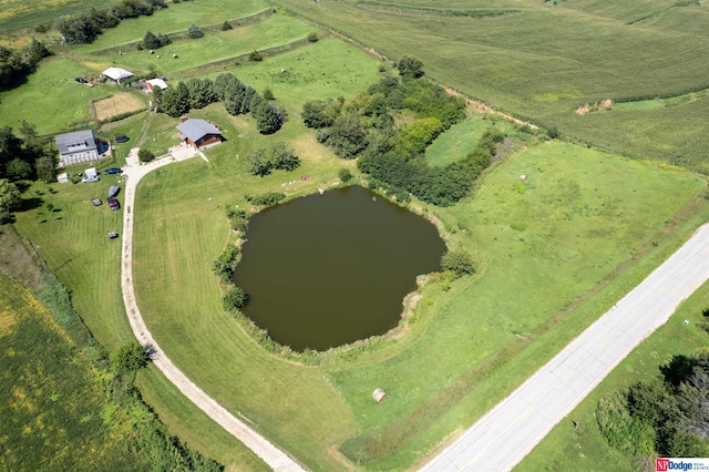 birds eye view of property featuring a water view and a rural view