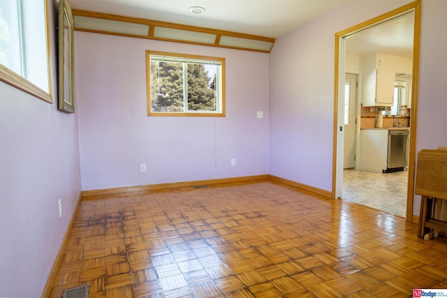 spare room with parquet floors