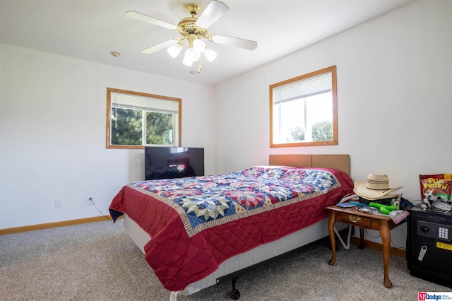 bedroom featuring carpet flooring, multiple windows, and ceiling fan