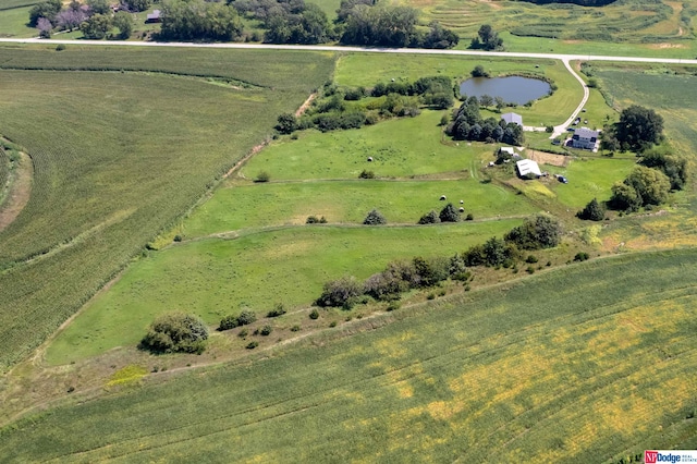 aerial view with a rural view and a water view