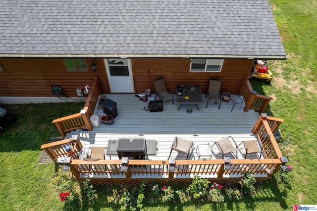 exterior space with a yard and a wooden deck