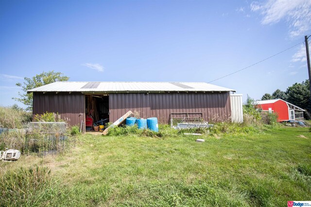 view of outdoor structure with a yard