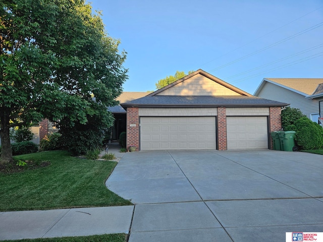 ranch-style home with a garage and a front lawn