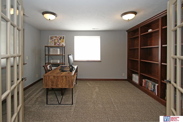 carpeted office featuring french doors