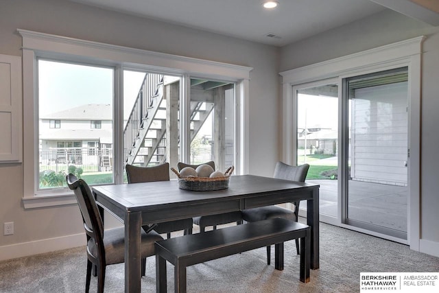 view of carpeted dining space