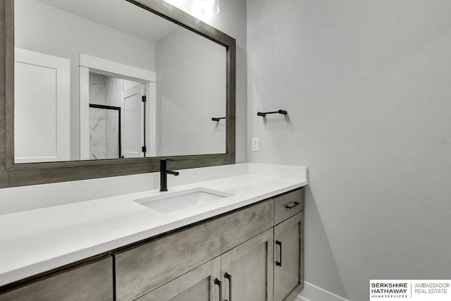 bathroom featuring vanity and a shower