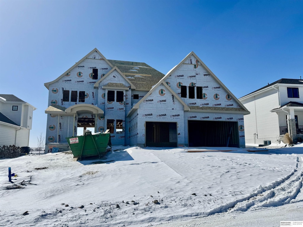 property in mid-construction with a garage