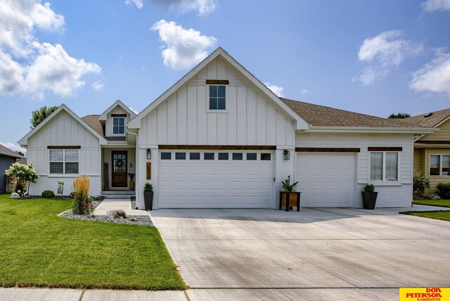 view of front of house featuring a garage and a front lawn