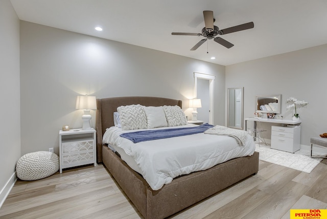 bedroom with ceiling fan and light wood-type flooring