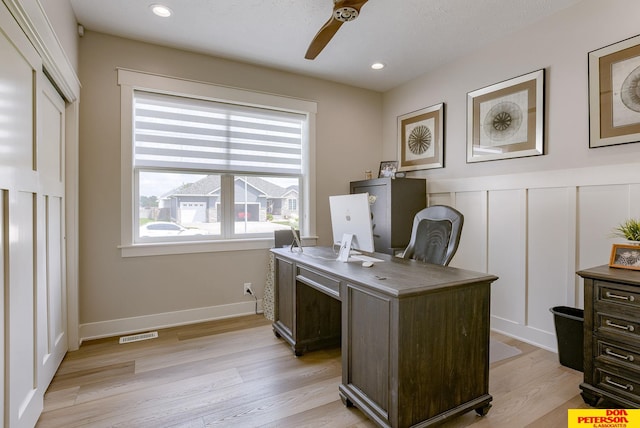 office with ceiling fan and light wood-type flooring