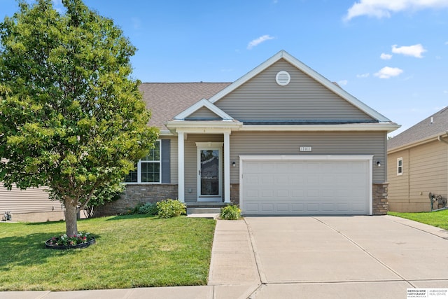 view of front facade with a garage and a front yard