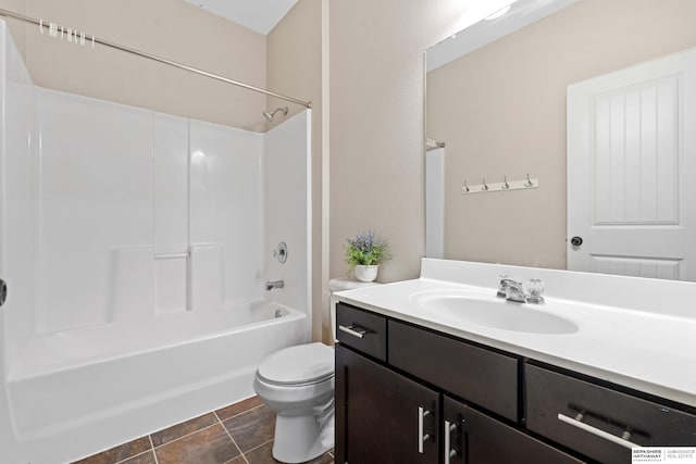 full bathroom with vanity, toilet, tile patterned floors, and shower / bathtub combination