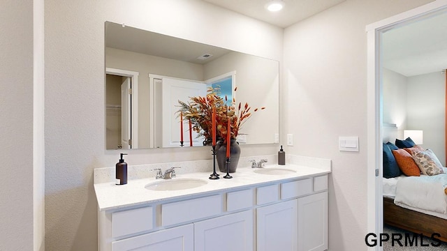 bathroom featuring dual bowl vanity