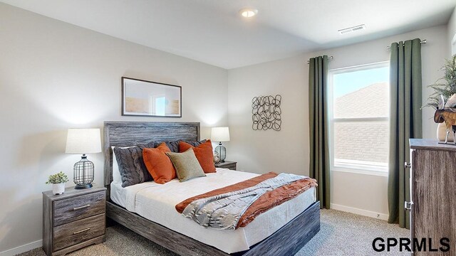 bedroom featuring light colored carpet