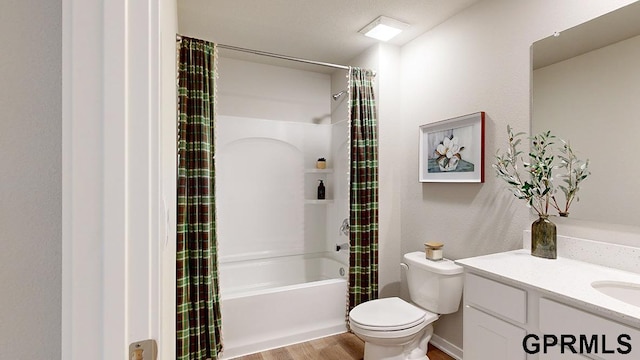 full bathroom featuring vanity, shower / bathtub combination with curtain, hardwood / wood-style flooring, toilet, and a textured ceiling