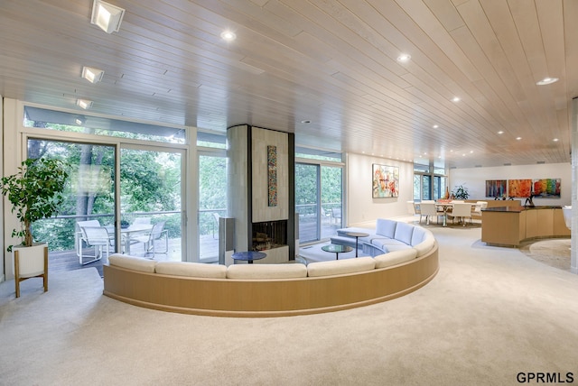 living room featuring light carpet and wood ceiling