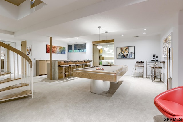 playroom featuring pool table, light colored carpet, and bar area