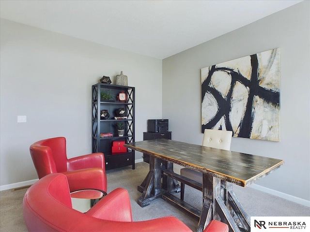 carpeted office space featuring baseboards