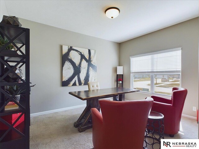 carpeted office with baseboards