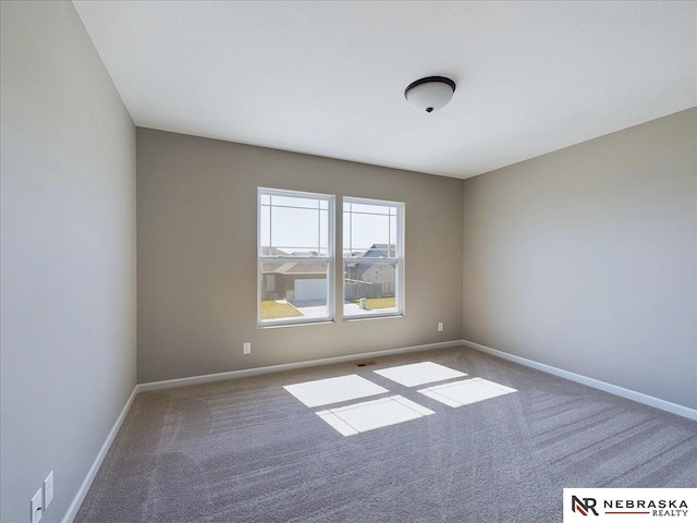 empty room featuring carpet flooring