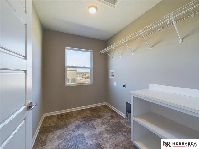 laundry area featuring visible vents, baseboards, washer hookup, laundry area, and hookup for an electric dryer
