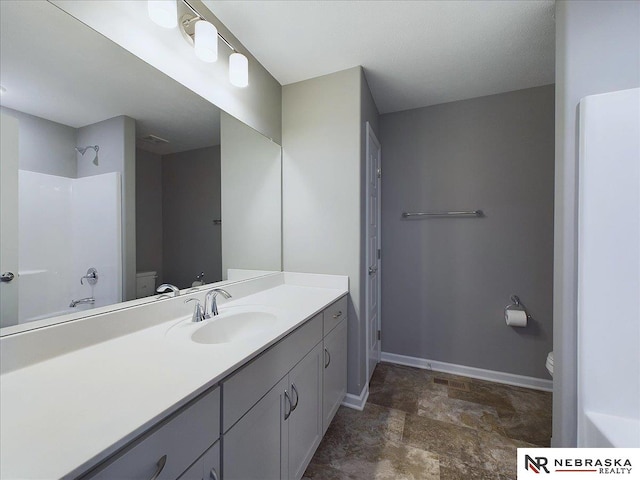 full bathroom featuring vanity, toilet, tile patterned floors, and shower / bathing tub combination