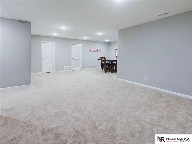 basement with light colored carpet