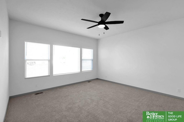 carpeted empty room with ceiling fan