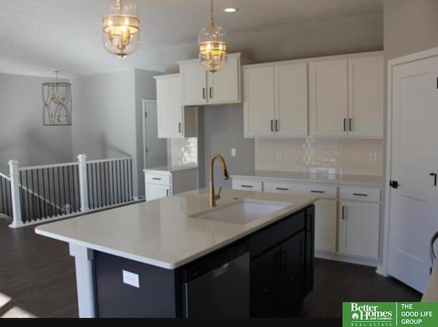 kitchen with pendant lighting, a center island with sink, sink, black dishwasher, and white cabinetry