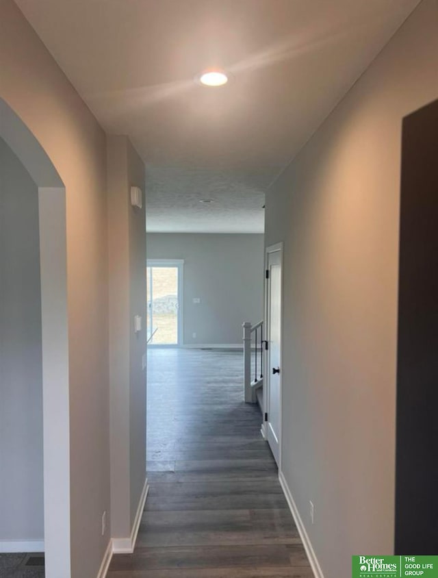 hall with dark hardwood / wood-style floors