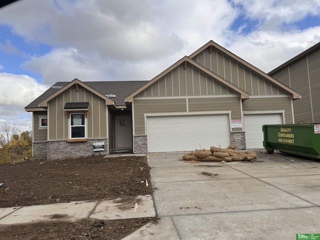 8707 N 177th St, Bennington, NE 68007 - craftsman-style house featuring board and batten siding, stone siding, and concrete driveway