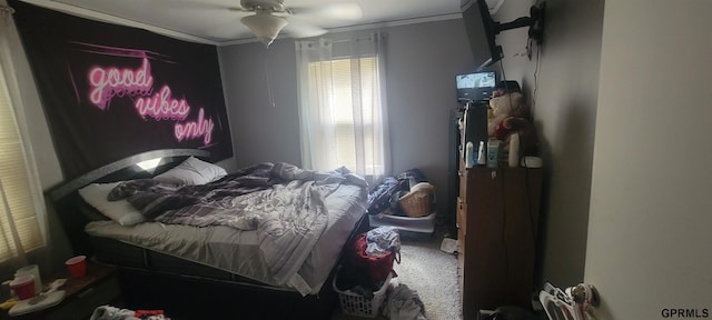 bedroom with crown molding, multiple windows, and ceiling fan