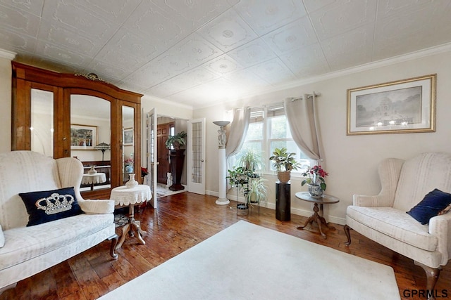 living room featuring crown molding and wood-type flooring