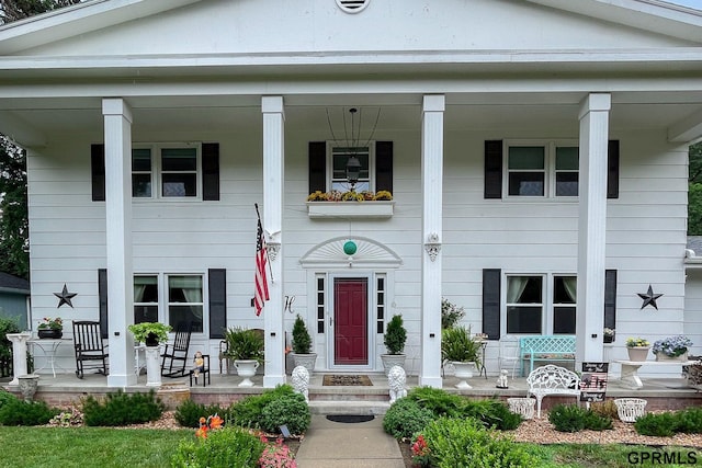 neoclassical home featuring covered porch