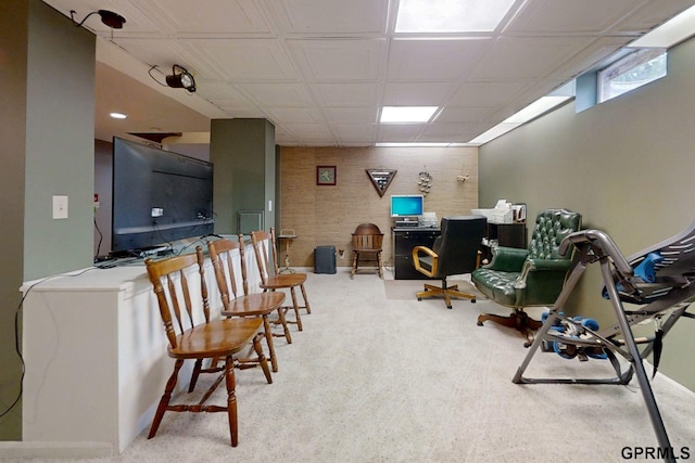 interior space with carpet flooring and a drop ceiling