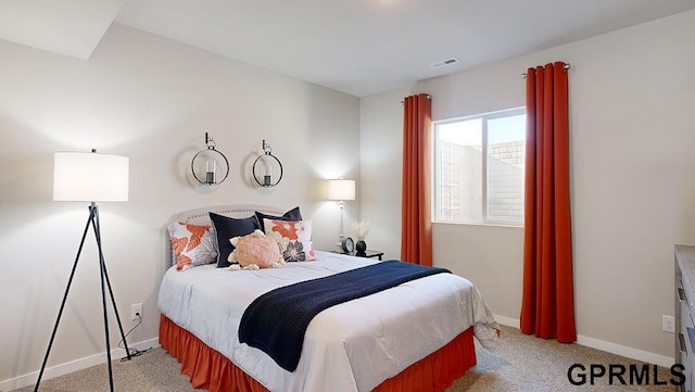 bedroom featuring light colored carpet