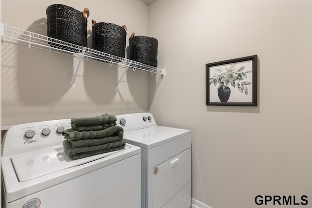 laundry area featuring washing machine and clothes dryer