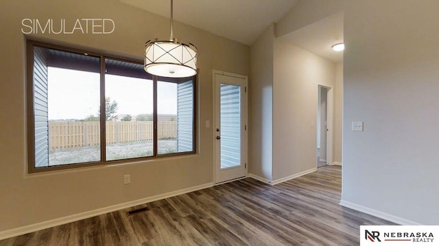 unfurnished dining area featuring wood-type flooring