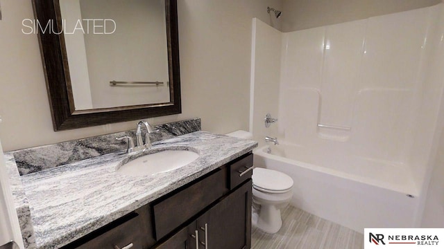 full bathroom featuring vanity, shower / tub combination, and toilet