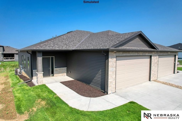 view of front of property featuring cooling unit, a garage, and a front yard