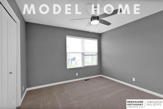 empty room with carpet and ceiling fan