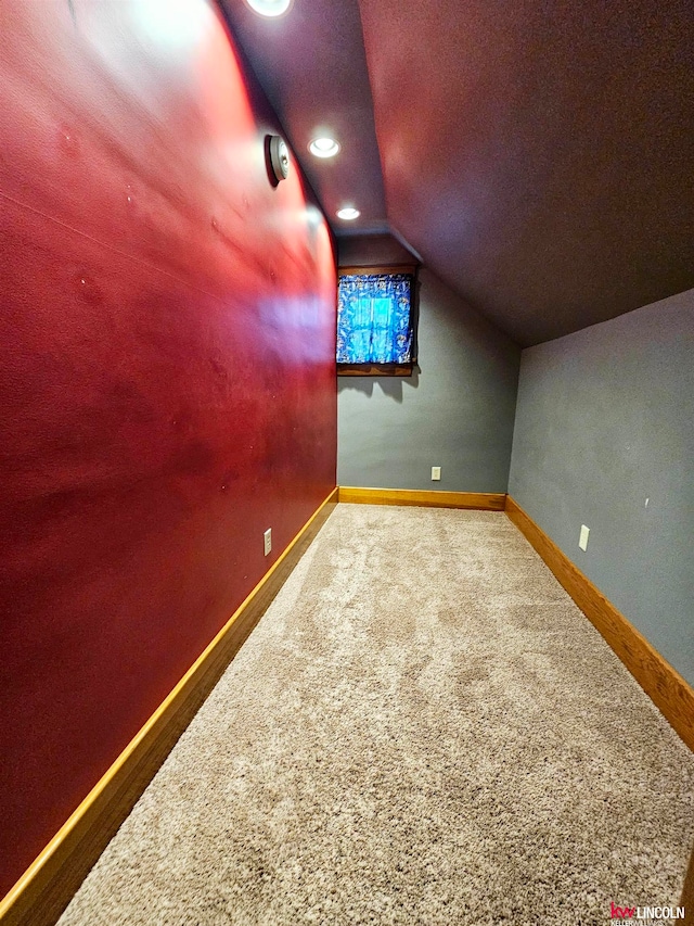 bonus room featuring hardwood / wood-style flooring and vaulted ceiling